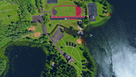 luxury lake coast resort with sport fields and accamodation, aerial top down view