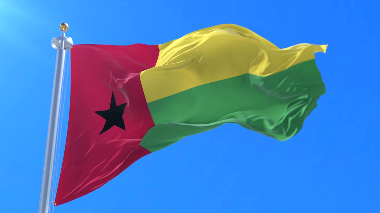 bandera de guinea bissau agitando el viento en lento en el cielo azul, bucle