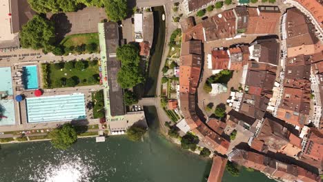 olten’s old town curve along river aare with historic rooftops, summer light and scenic bridge, drone top aerial view