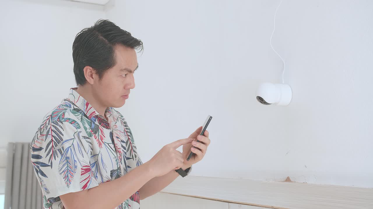 Asian Man Use Mobile Phone Control Security Cctv Camera