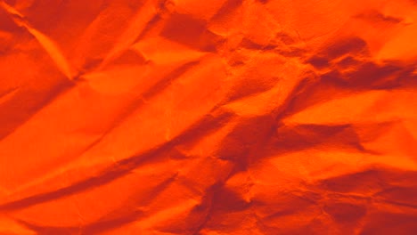 vibrant crumpled red and orange paper texture background