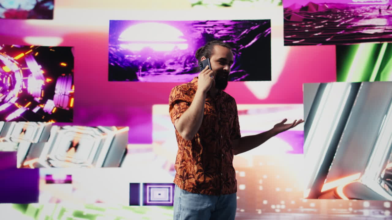 Artistic person and DJ answering phone call under vibrant neon lights