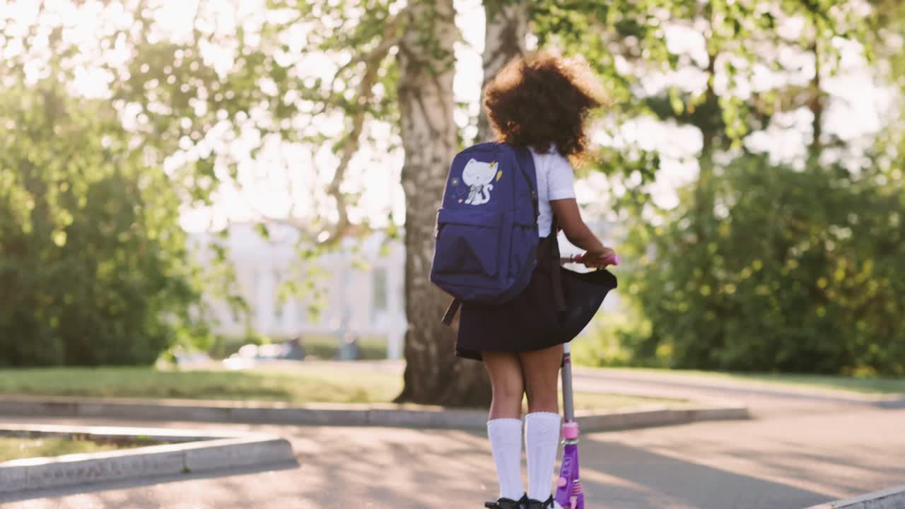 Girl Riding Scooter in Park