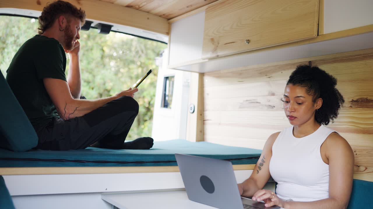 Couple Working in a Van