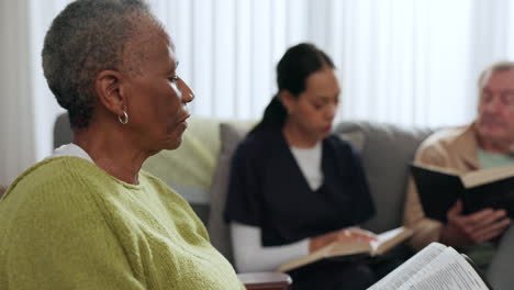 Elderly-black-woman,-bible-and-group-in-home