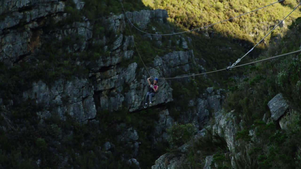 Young Caucasian woman zip lining