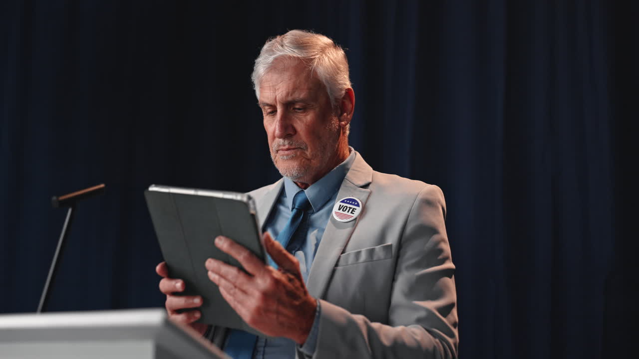 Man with tablet giving speech about vote