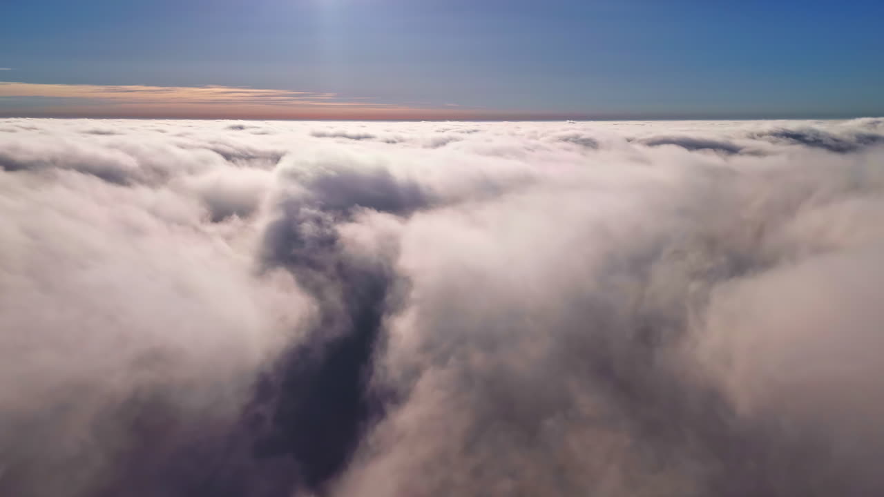 Flying above the clouds. Dreamy scenic footage
