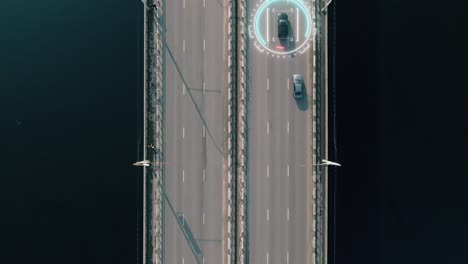 vista aérea del puente con automóviles y superposición de seguimiento