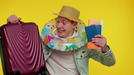 summer vacation, traveler tourist teen student man celebrating, holding passport, tickets, luggage