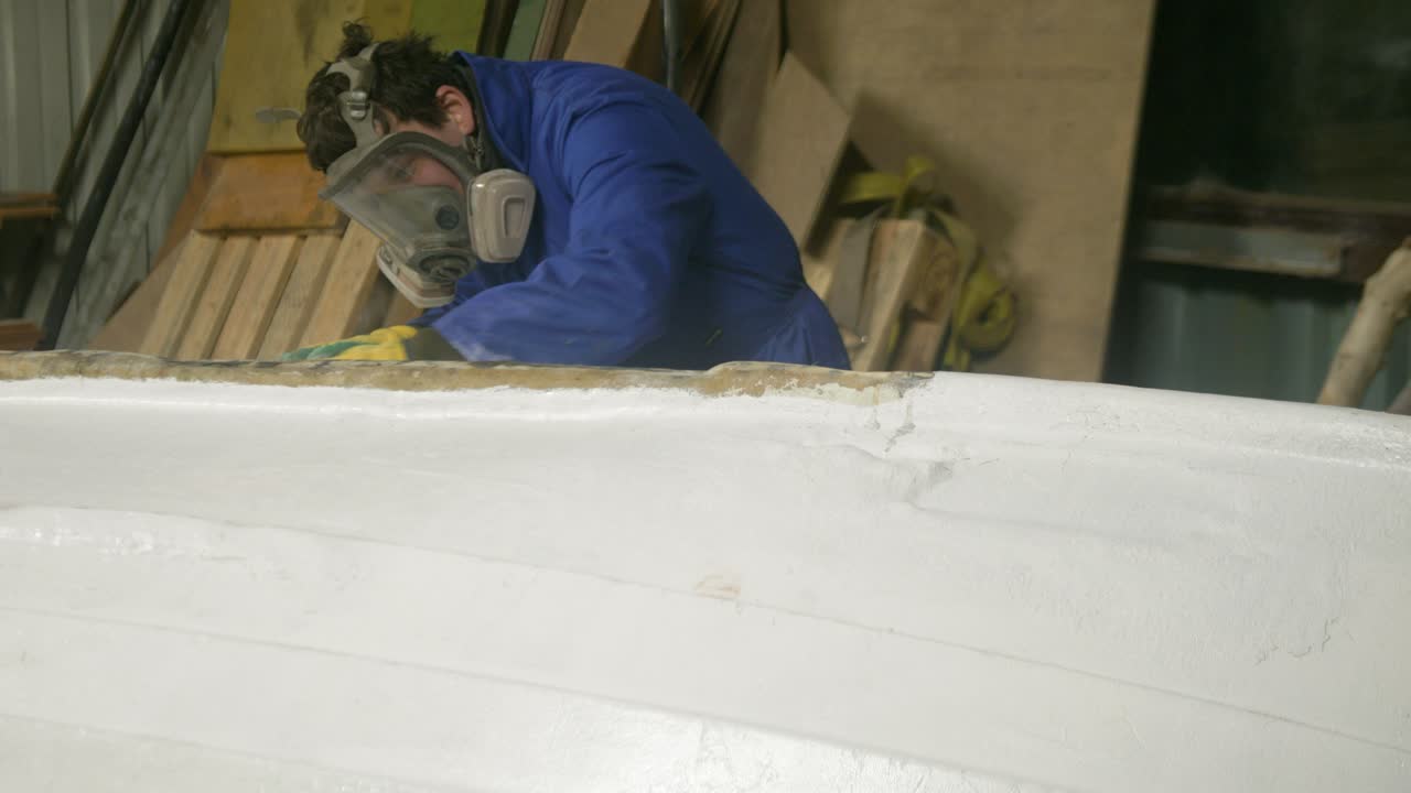 Sanding bottom paint fiberglass boat hull