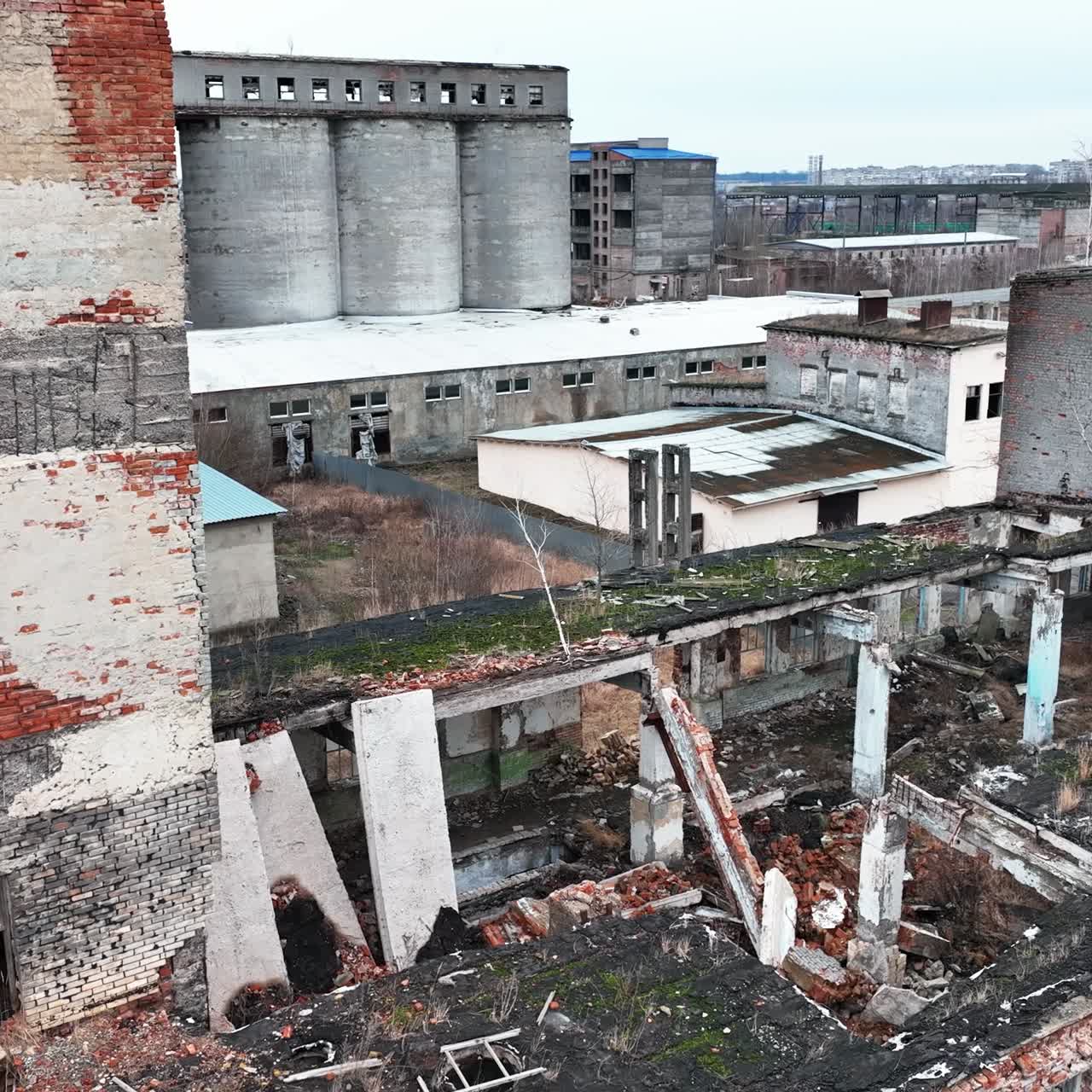 Wrecked buildings damaged by air bombing. Wartime consequences for the urban territory. Ruins after explosion