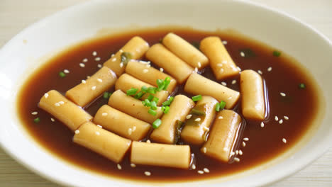 spicy jjajang tteokbokki or korean rice cake in spicy black bean sauce - korean food style