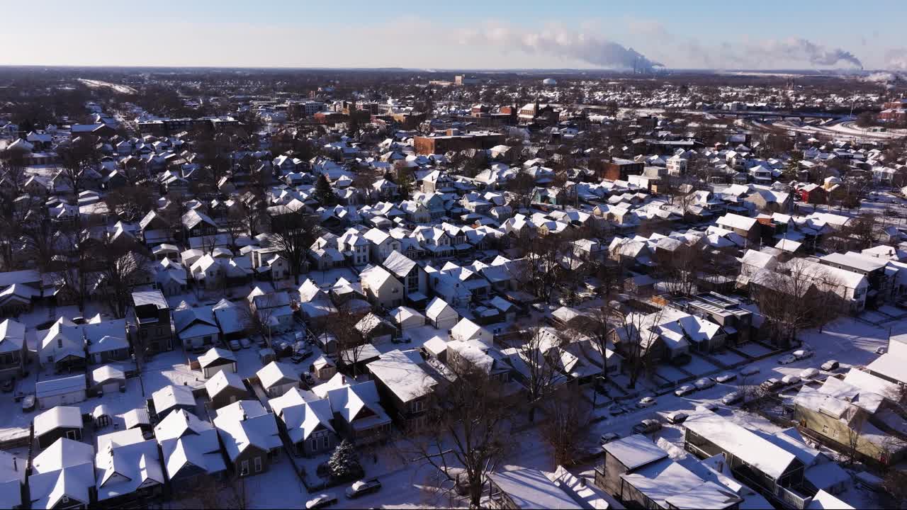 Establishing Drone Shot Above Snow Covered Houses in Residential Neighborhood on Cold Winter Day
