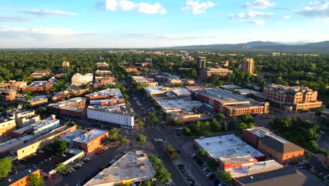 aerial view of a town with lush greenery and distant mountains