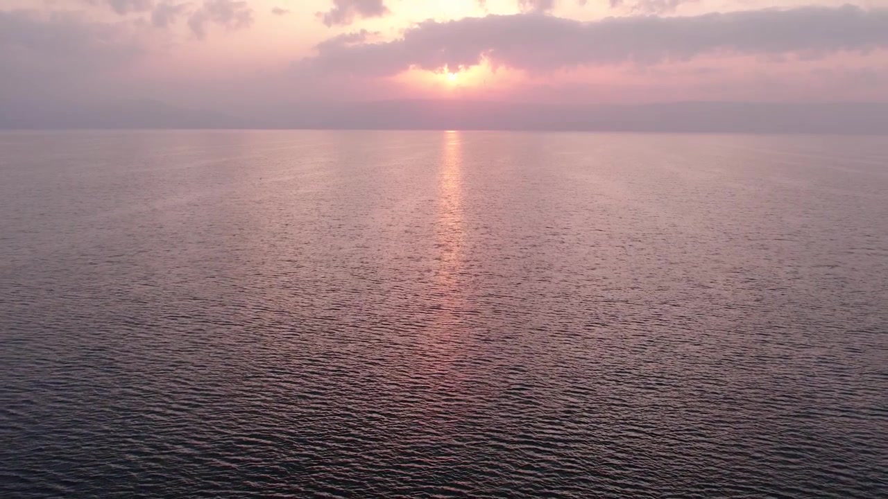 Aerial View of Golden Sunset over Calm Sea Water