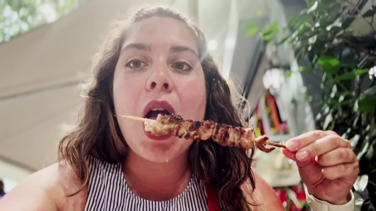 Vlogger Woman Enjoying Authentic Greek Souvlaki in Athens