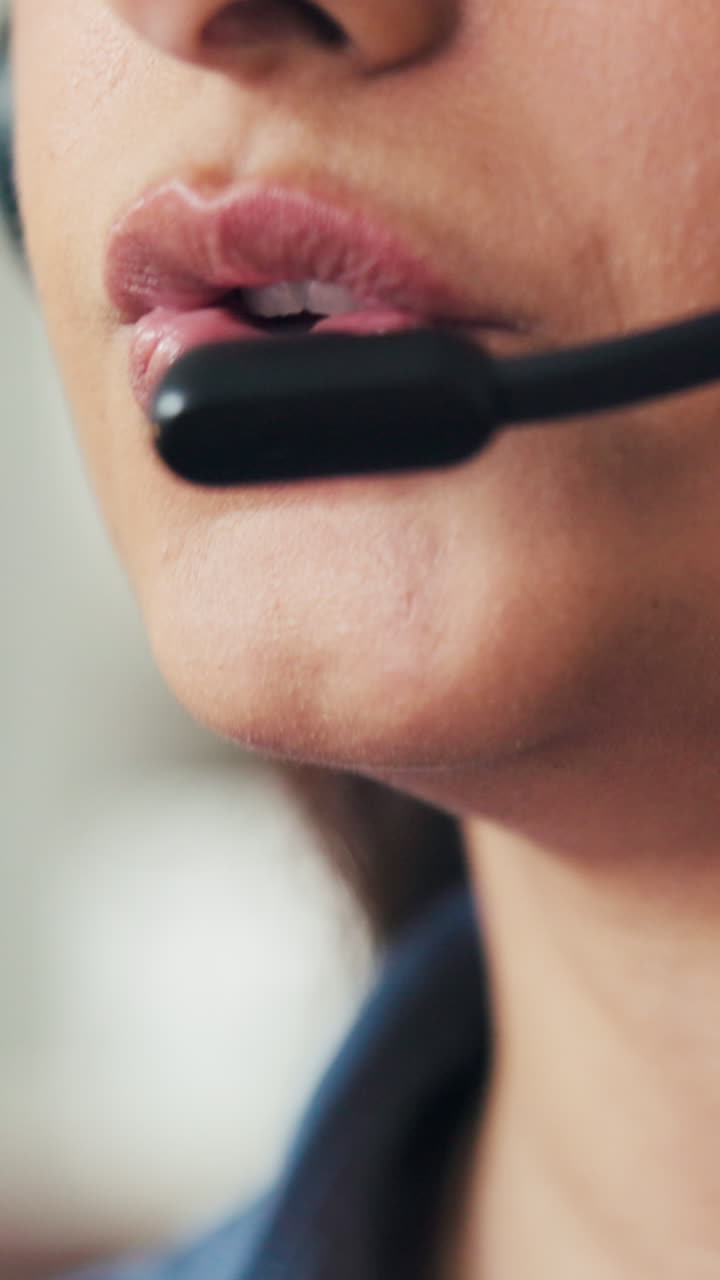 Close-up of Woman's Mouth Speaking into Headset Microphone