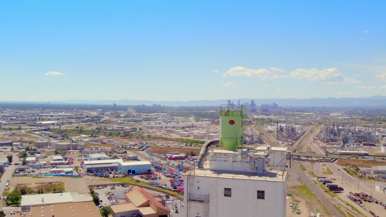 Orbit around Top of Factory with Denver Colorado in Background