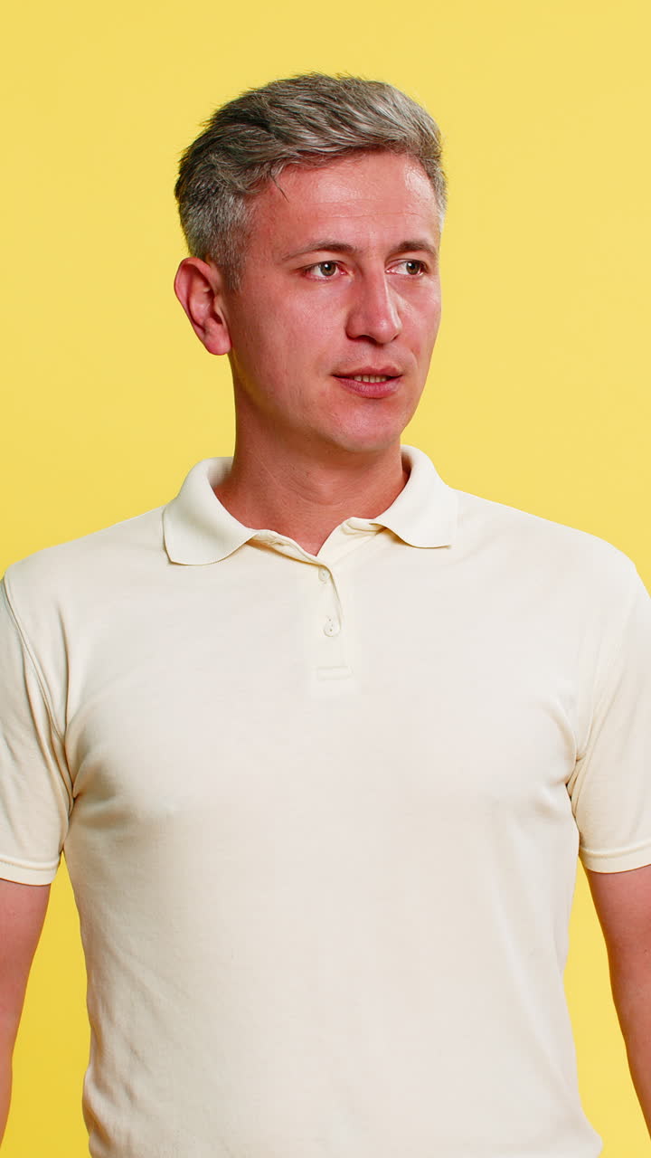 Adult man yelling at smartphone angrily arguing during call pressing end button with hand gestures