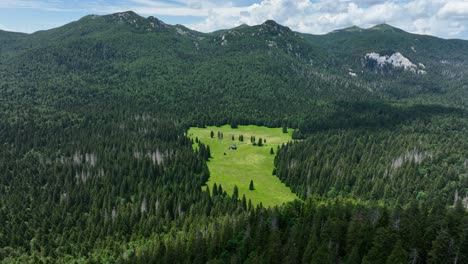 mountain valley with cabin