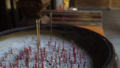 incense slowly burning in quiet chinese taoist temple