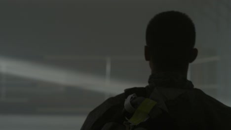 person in dark interior
