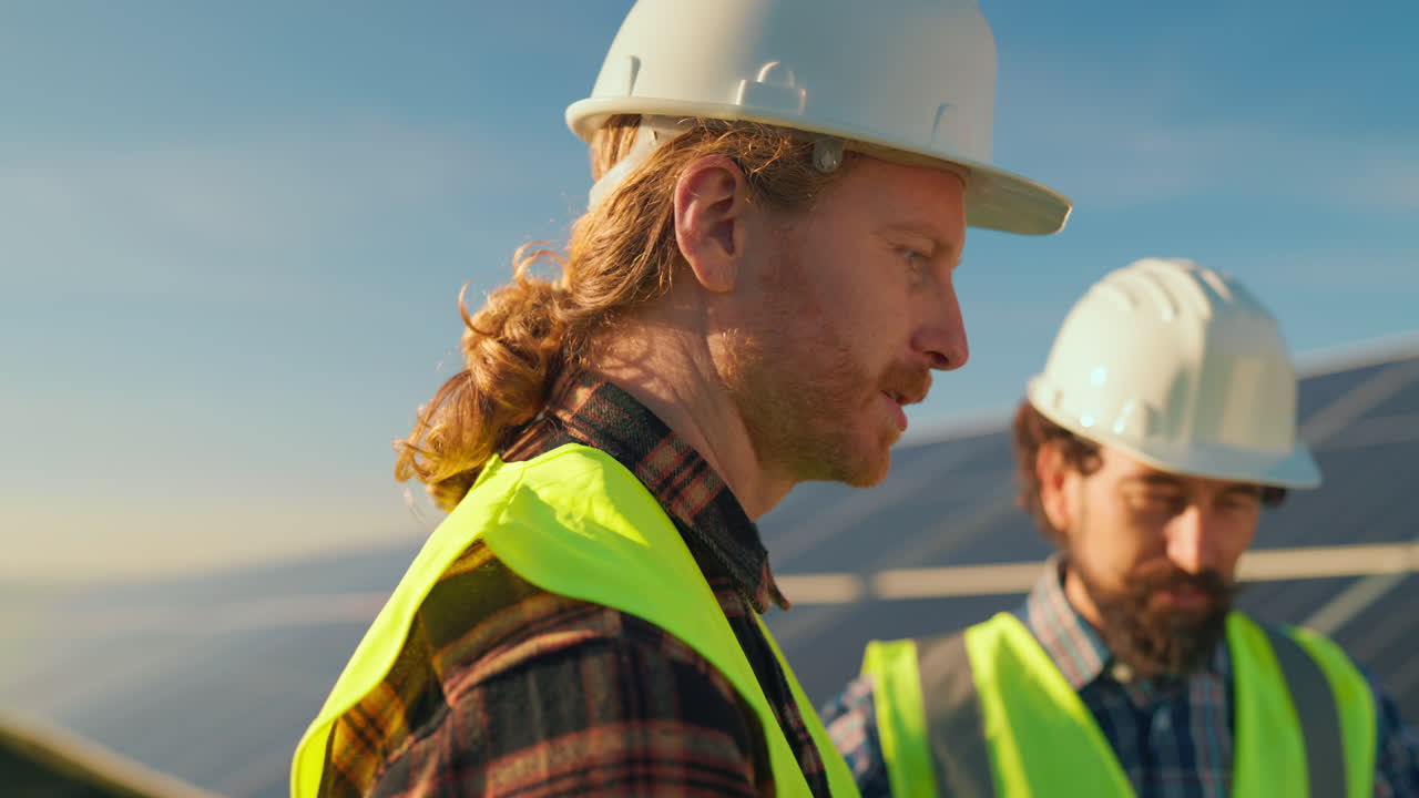 Engineers inspecting solar panels