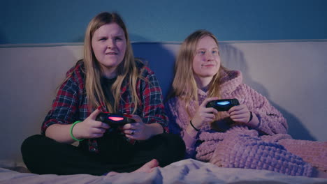 teenage girls playing video games