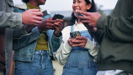group of teenagers using smartphones