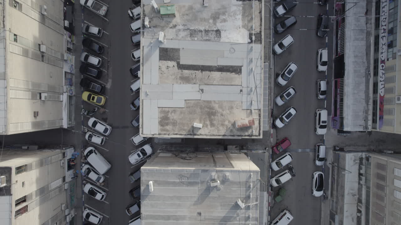 Aerial view of city buildings and parking lot