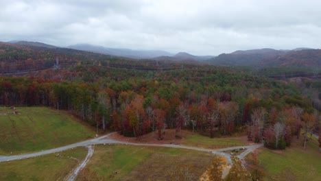 an elevator drone shot of the fall mountains in sunset, south carolina