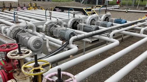 Establishing-shot-of-a-large-fuel-compound-with-fuel-pumps-and-pipes