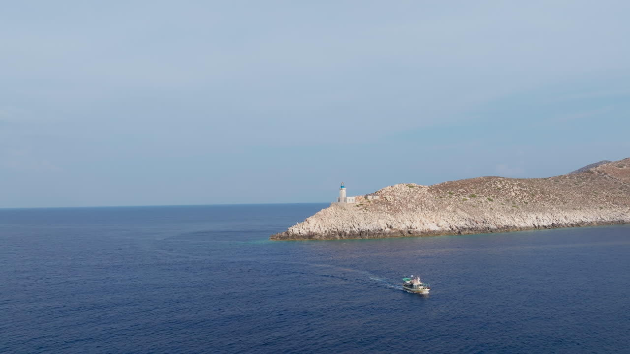 High aerial establishing of Cape Tainaron extending into Aegean Sea, rugged shoreline and vast seascape