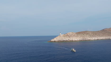 high aerial establishing of cape tainaron extending into aegean sea, rugged shoreline and vast seascape