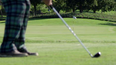 slow motion man hitting iron on golf course hd