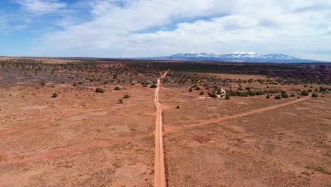 aerial drone shot over an off-road trail in the deserts of utah