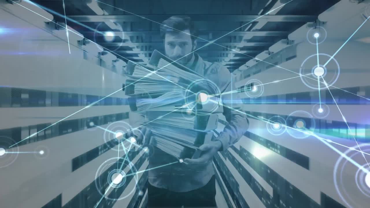 Portrait of man holding office files with computer servers in tech room