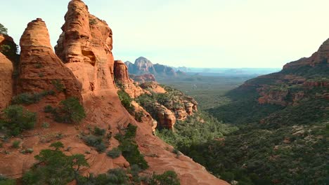 Aerial-view-drone-reveal-of-Sedona-Valley,-Capitol-Butte-in-distance