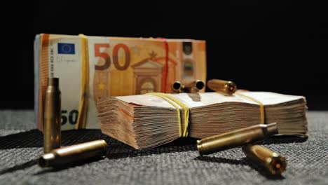 symbolic contrast of money and violence in a dark, moody composition