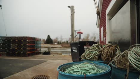 lobster fishing equipment with fishing traps on the pier in maine, 4k video