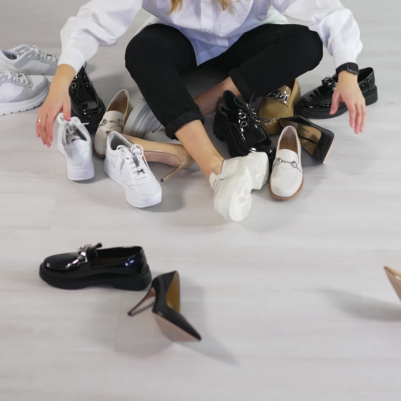 Footwear choosing stylish lifestyle. Shoes woman luxury woman sitting