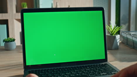entrepreneur browsing mockup laptop at workplace close up. unrecognizable man