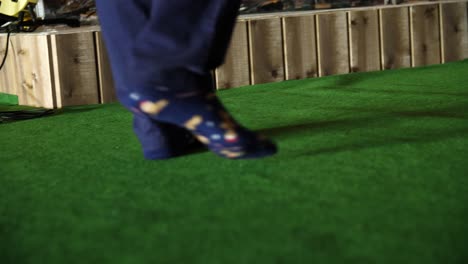 person walking on artificial grass