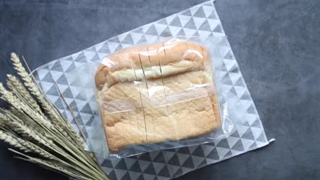 sliced loaf of white bread in plastic bag