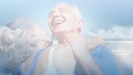 animación de luz brillante sobre una feliz pareja de ancianos bailando a la orilla del mar