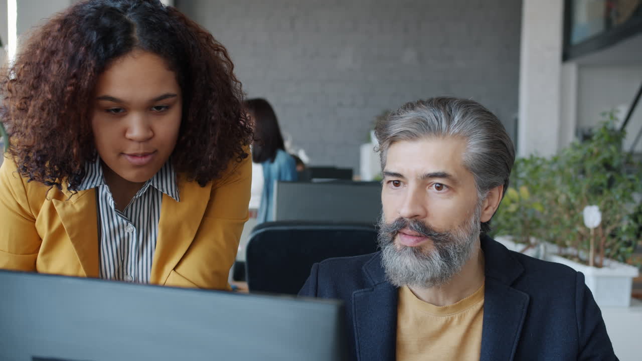 Business Colleagues Discussing a Project at a Meeting
