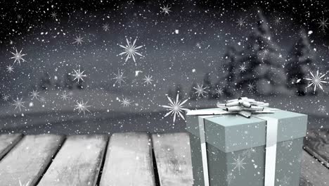 Animation-of-falling-snow-and-white-snowflakes-over-christmas-gift-box-and-winter-night-landscape