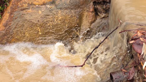 water cascades over a rocky ledge