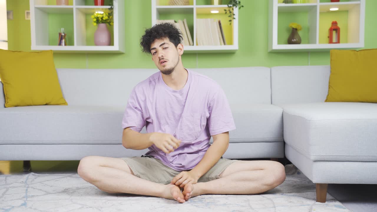 ⁇ 을 흘리고 우울한 젊은이